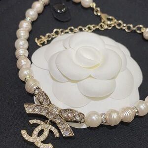 CHANEL Ivory Pearl Necklace with Crystal Logo